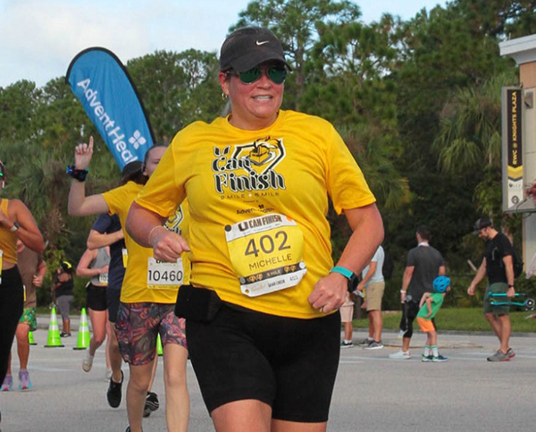 Woman crossing finish line